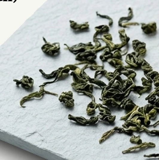 Four Seasons tea leaves photographed close-up with a brighter fresh tone.