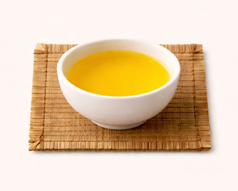 Jin Xuan tea leaves photographed close-up with a softer creamy tone.